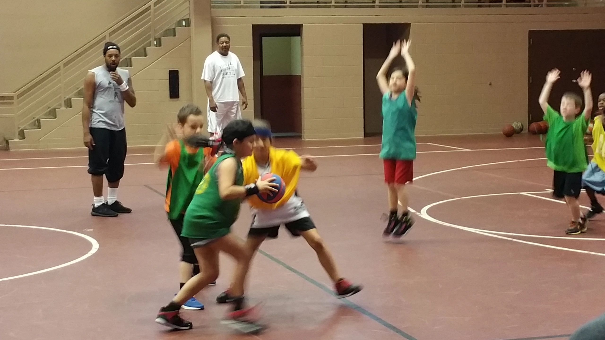 Children playing basketball action shot
