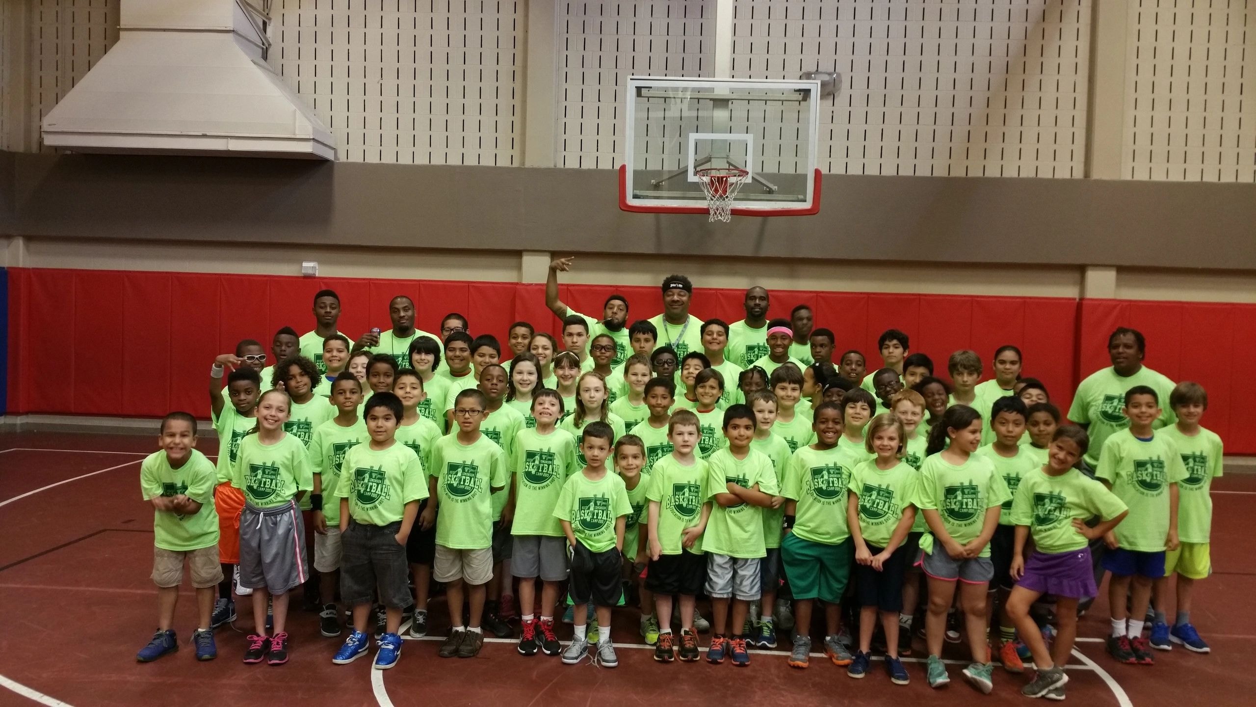 Indoor soccer with neon green jerseys