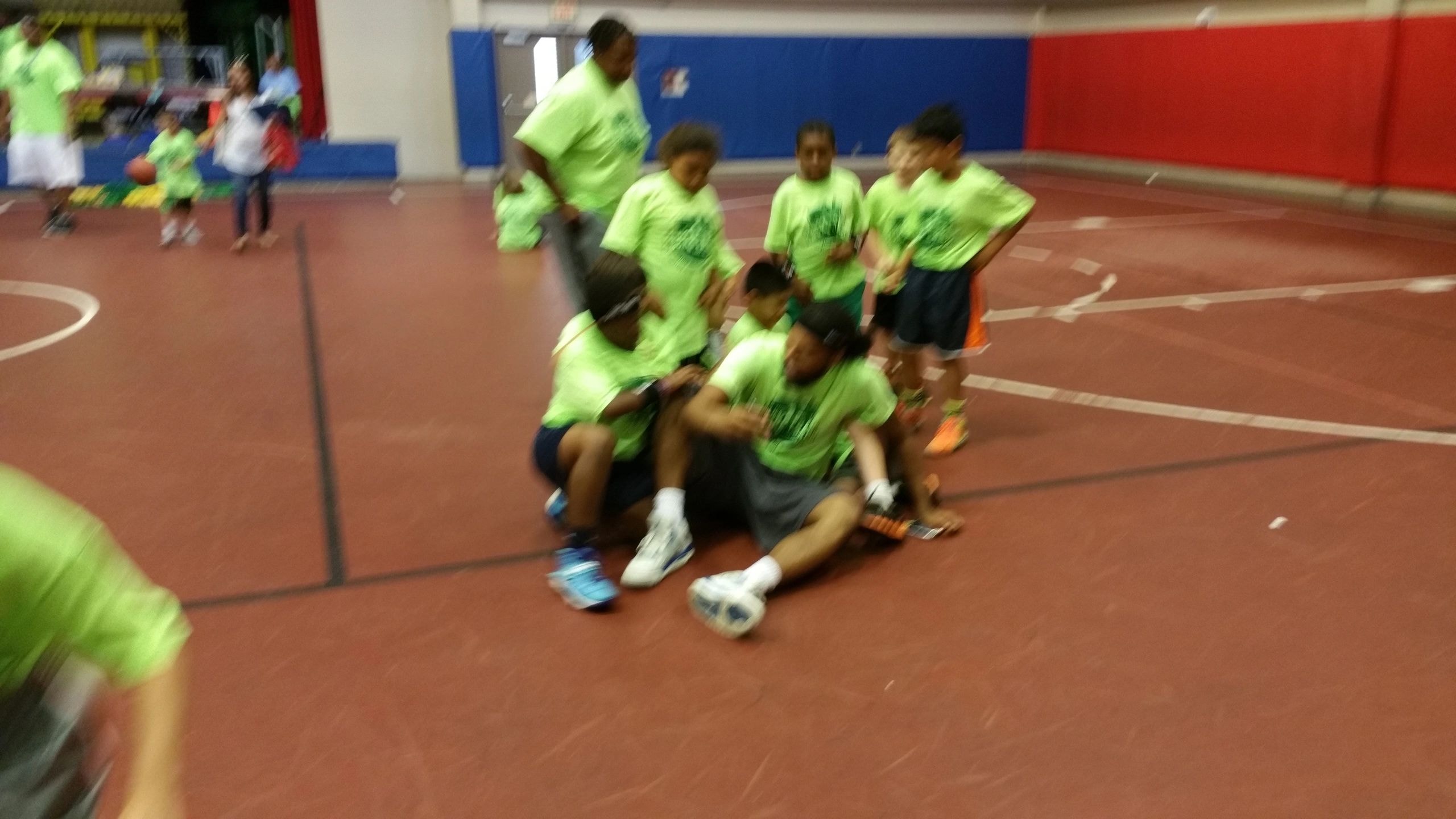 Children gym activity with neon yellow shirts